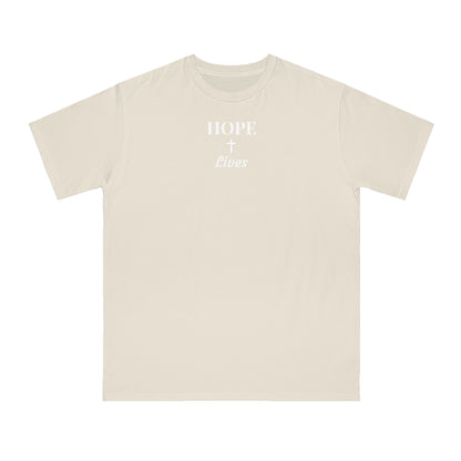 Beige T-shirt with white text and cross reading 'HOPE + Lives' on front center